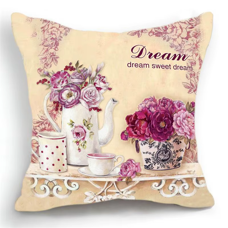 dekoratiivpadi lillede ja teekannuga, millel on kiri 'dream sweet dream'