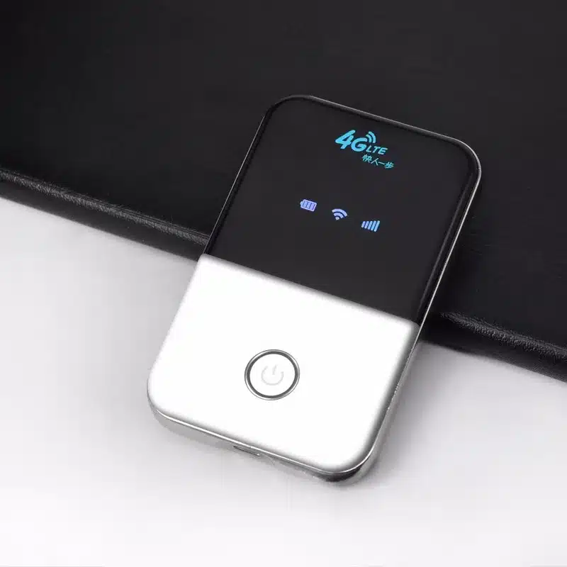 must-valge kaasaskantav wifi ruuter laual