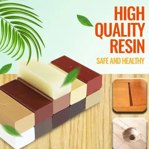 Eri toonides Parandusvaha puidu jaoks asetatud puidust pinnale, ümbritsetud roheliste lehtedega, taustal sõnad High Quality Resin, Safe and Healthy.