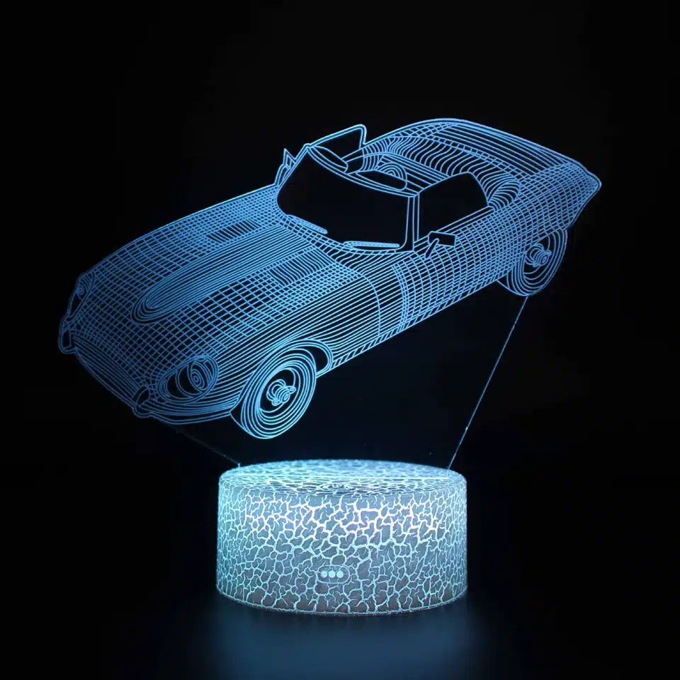 sinine LED öölamp auto kujutisega, mis on paigutatud ümmargusele alusele