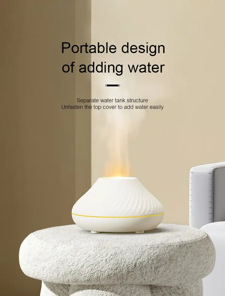 valge eeterliku õli lamp, mis eraldab auru ja on paigutatud hallile pinnale