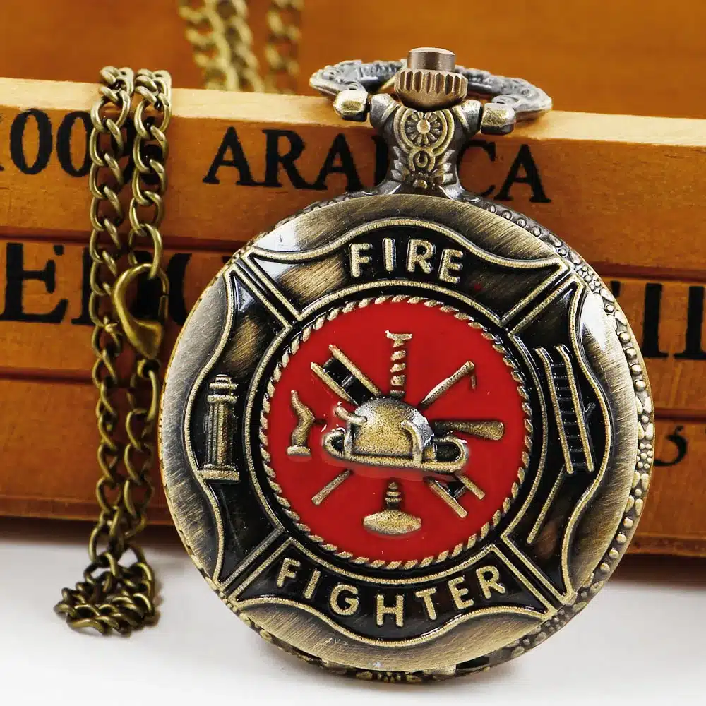 pronksikarva taskukell punase embleemiga, millel kiri 'fire fighter'
