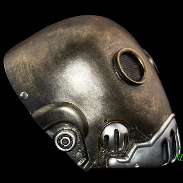 metallilise välimusega hõbedane ja pronksjas mask, millel on ümarad detailid ja võrgusilmad