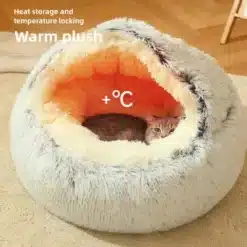 hall ja oranž pehme pesa, milles lamab kass