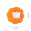 oranž käsn, mille keskel on valge karu nägu