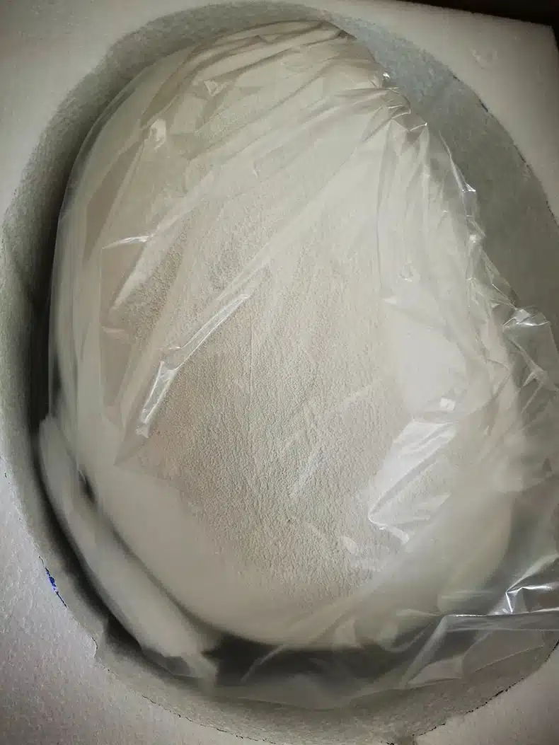 Scandinavian-style LED ceiling lamp packed securely in white protective foam, partially visible through transparent plastic wrap.