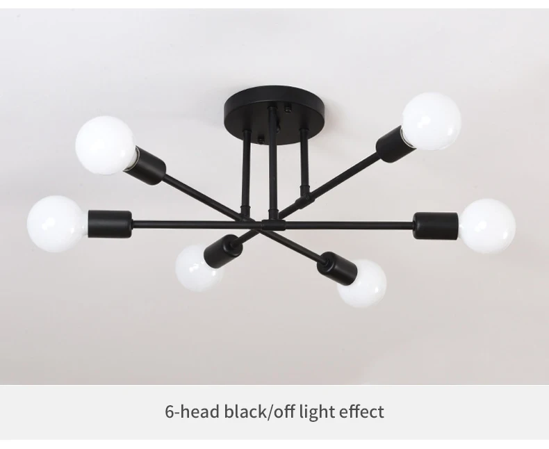 Moodsad 6 pirniga laelamp musta värvi metallkonstruktsiooniga, paigaldatud helevalgele laele. Lampide valge sfääriline kuppel loob elegantse ja minimalistliku disaini, sobides kaasaegsesse interjööri.