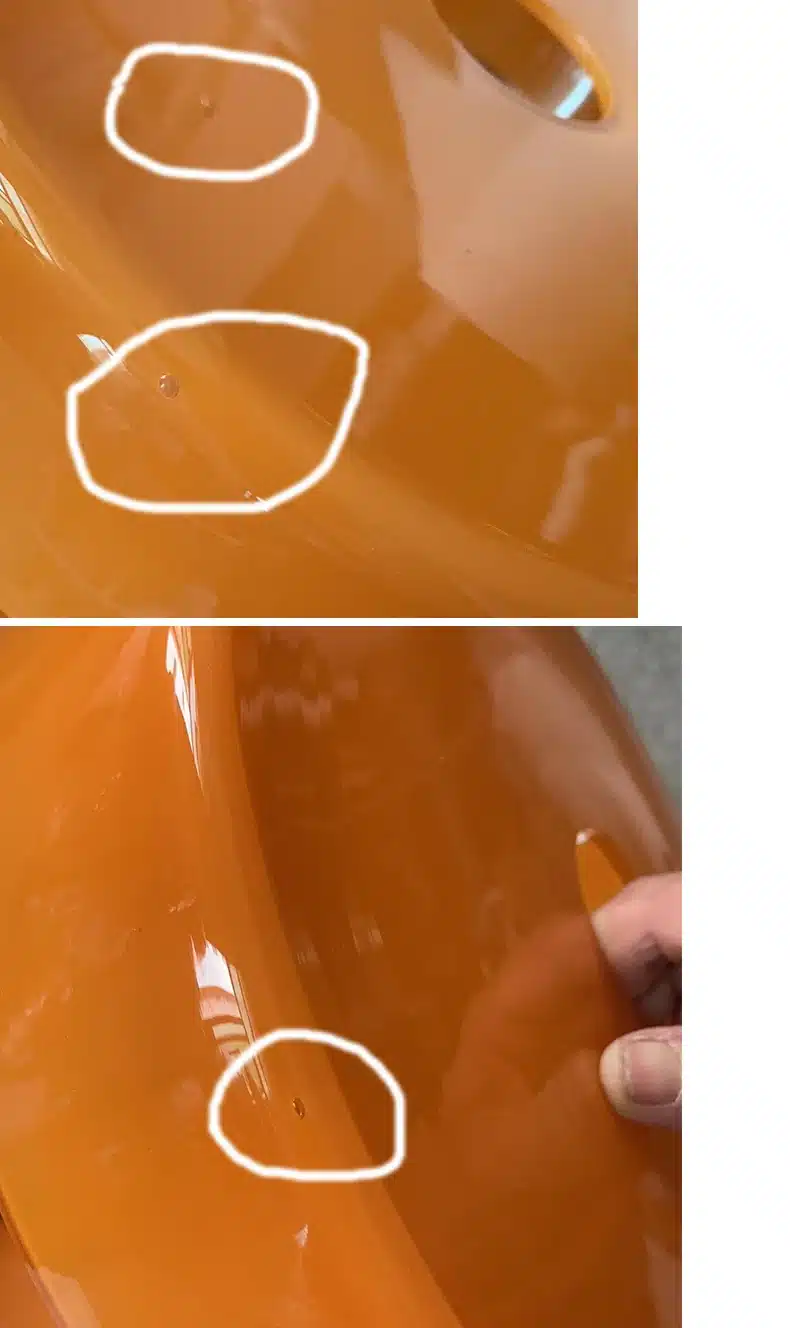 Moodsad põhjamaised klaasist rippvalgustid kööki, nähtavad detailid oranžis klaasis, millel on väikesed pindmised puudused, taustal neutraalne keskkond.