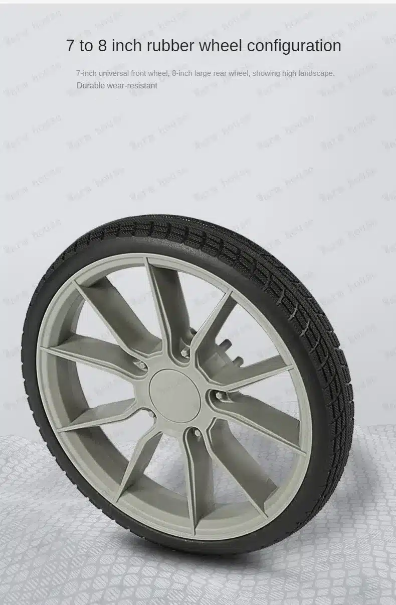 Hall ja must kummiratast keeratud asendis, 7-8 tolli suurus, mis kuulub multifunktsionaalsete kergete beebide reisikärude juurde, punutud mustriga rehv tagab suurepärase haarduvuse.