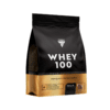 Valgupulber TREC GOLD CORE WHEY 100 CHOCOLATE 900g mustas ja kuldses pakendis, milles on kõrge kvaliteediga proteiinisegu. Pakend seisab valgel taustal.