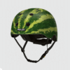 Kiiver MELON Real Melon (XL) on stiilne ja turvaline linnakiiver, millel on unikaalne arbuusimuster. Kiivri tugev konstruktsioon tagab maksimaalse kaitse, samal ajal kui mustriline disain lisab värsket ja eristuvat välimust. Taust on hele ja neutraalne.