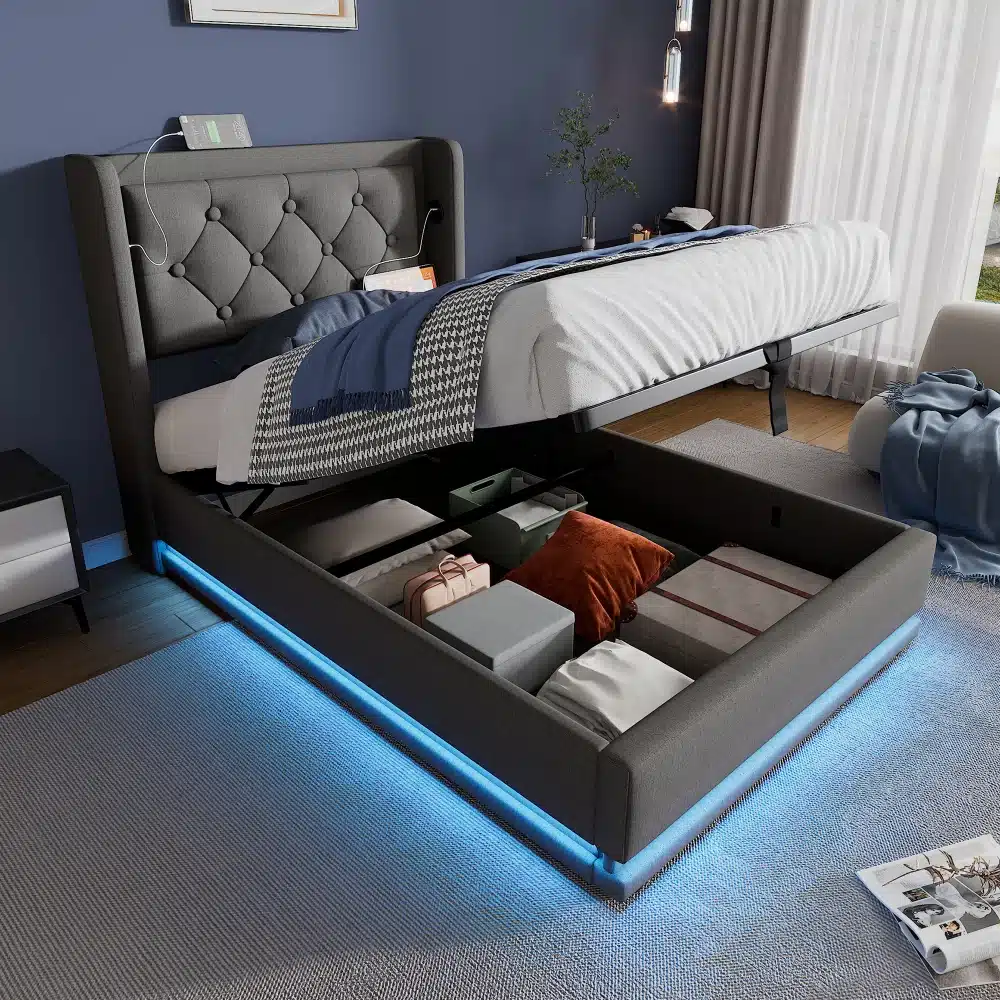 Hall polsterdatud voodi pesukastiga, USB ja LED-valgustusega 90x200, avatud pesukasti ja mugava madratsiga, seisab sinises toas valgusvoos.