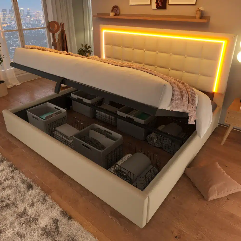 Pesukastiga voodi, LED-valgustusega 140x200, avatud hoiustamisruumiga. Voodi raam on heledast kangast, modernse disainiga, taustal soe LED-valgustus. Puitpõrand ja linnavaade aknast.
