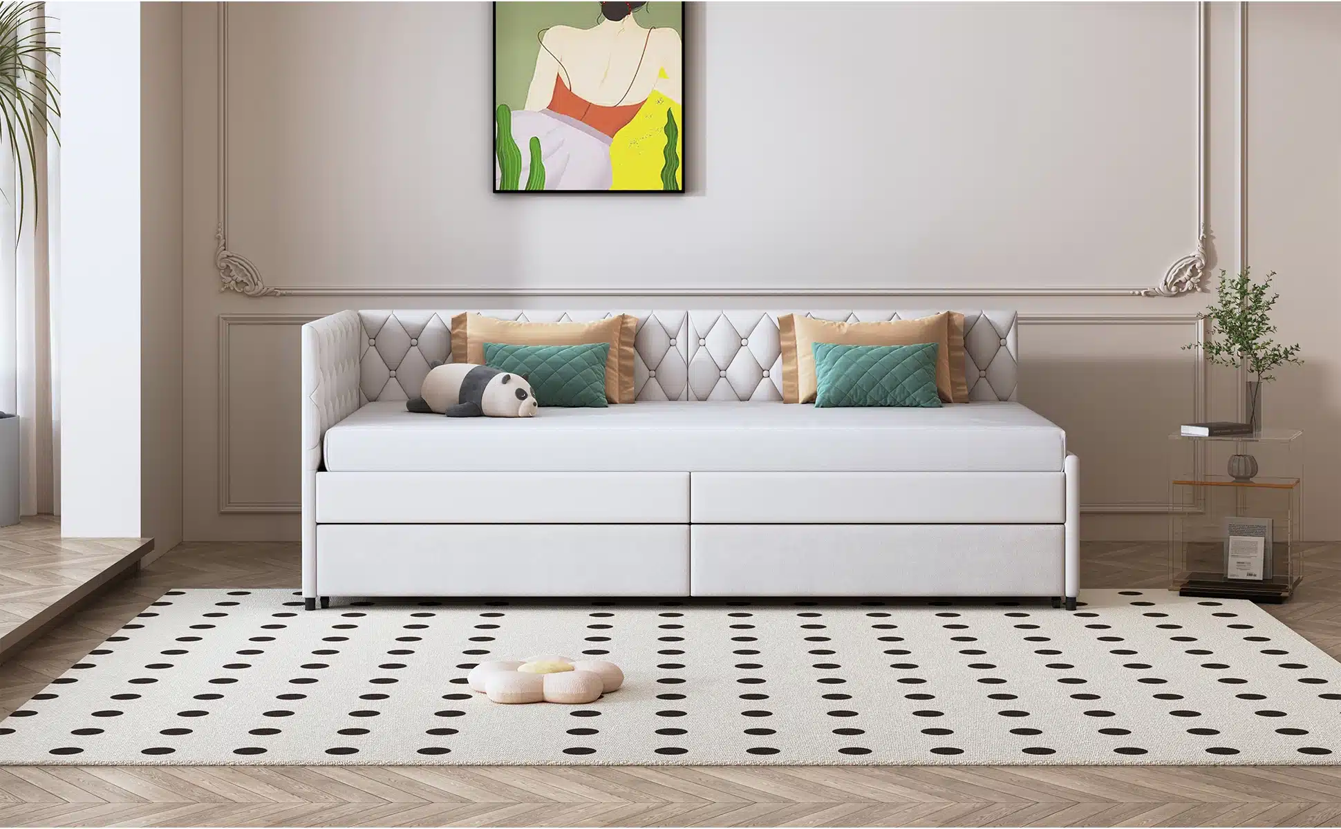 Diivanvoodi ratastel sametist, hall 90x200 cm, seisab elegantses ruumis heledal parkettpõrandal mustade täppidega vaibal. Diivanvoodil on seljatoe ääres mitu patja ning selle kohal on kaasaegne kunstiteos heledal seinataustal.
