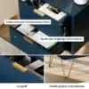 Tumesinine öökapp kahe sahtliga, millel on kuldsed käepidemed ja metalljalgadel. Puidust põrandal asetsev kapp pakub stiilset ladustamisvõimalust.
