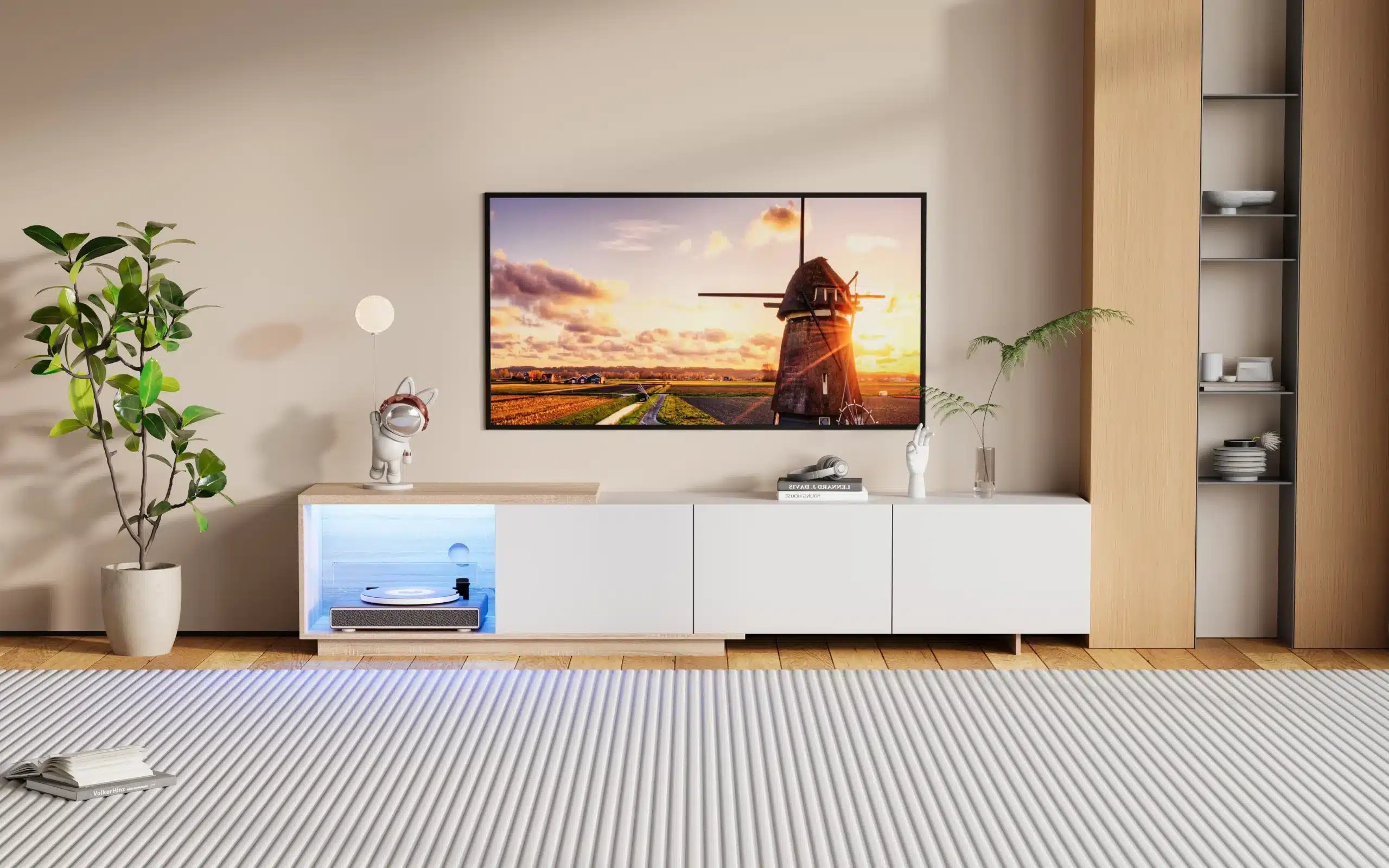 Elutoas on minimalistliku disainiga must TV-alus, millel on 3 sahtlit ja LED valgustus, mõõtmetega 240x38x44 cm. TV-aluse kõrval on roheline toataim potis ja seinal suur televiisor, millel näidatakse päikeseloojangut maastikuvaatega.