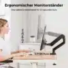 Valge ja must reguleeritav monitorihoidik, mis toetab 13–32-tollist ekraani, asetatud puidust lauale kaasaegses kontoris. Ekraan on ideaalses silmakõrguses, taustal neutraalsed toonid, seadistatud ergonoomika parandamiseks.