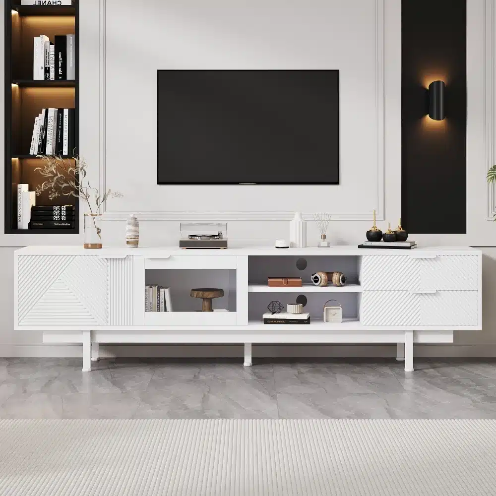 Musta minimalistliku disainiga Tv-alus mõõtmetega 200x40x50,5 cm, millel on kaks sahtlit ja peen viimistlus, sobitud modernsesse elutuppa, taustaks stiilne valge sein.