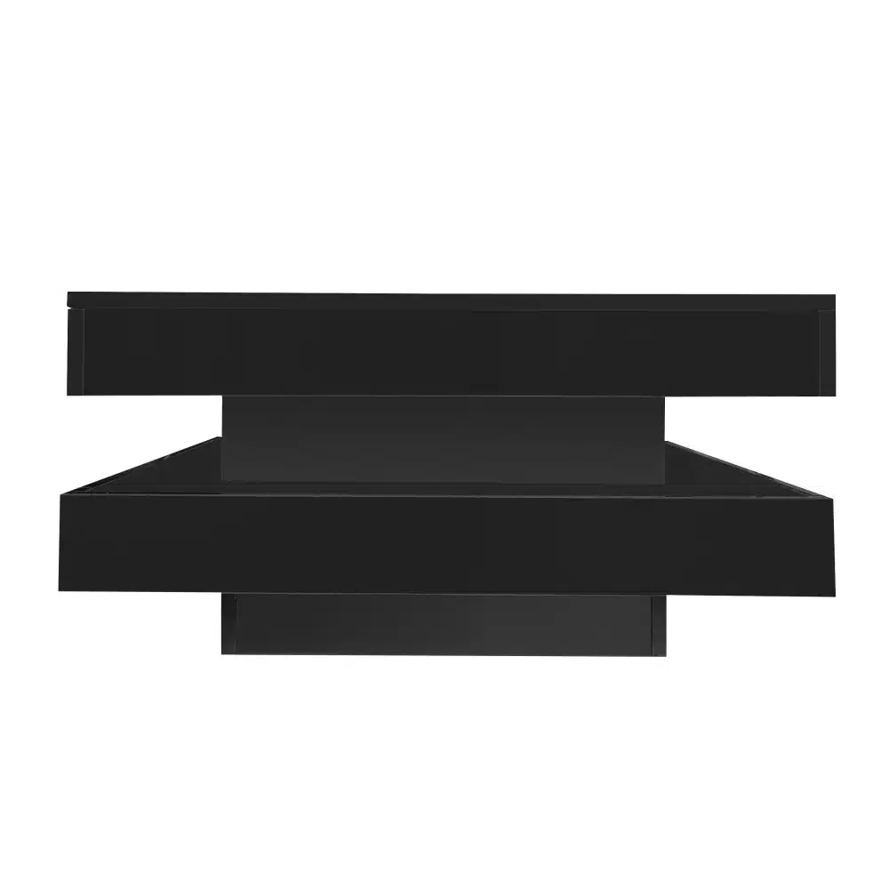 Diivanilaud LED valgustusega, pöörlev kandik, mustast läikivast materjalist. Laud on kaasaegse ja minimalistliku disainiga, millel on integreeritud LED valgustus, mis paistab läbi elegantse tasapinna.