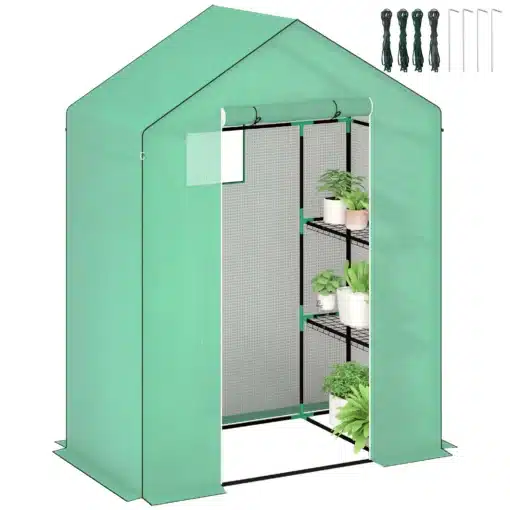 Kasvuhoone riiulitega UV-kaitsega roheline 143x74x190cm | E-pood Tootemaailm Roheline kasvuhoone riiulitega, valmistatud vastupidavast materjalist ja varustatud UV-kaitsega, mõõtudega 143x74x190cm, seisab aias rohuga kaetud pinnal.