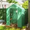 Kasvuhoone riiulitega UV-kaitsega roheline 143x74x190cm | E-pood Tootemaailm Roheline kasvuhoone riiulitega, mille UV-kaitsega kate tagab taimedele kaitse päikese eest. Kasvuhoone mõõtmed on 143x74x190cm ning see paikneb aiakahvli taustal rohelise aia kõrval. Riiulitel on paigutatud erinevaid potitaimi, mis loovad hubase ja produktiivse aiakeskkonna.