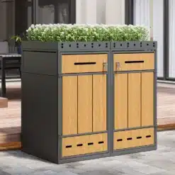Prügikastikapp istutuskastiga lukustatav õue 132x124cm, valmistatud vineerilaadsest materjalist ja metallraamist, halli ja puiduvärvi kombinatsioonis. Ülemises servas on roheline taimede rida, kapi uksed on lukustatavad ja kast sobib kasutamiseks õues.