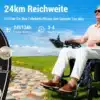 Elektriline ratastool kokkupandav 24 km ulatus, 150 kg kandevõime | E-pood Tootemaailm Vanem inimene istub elektrilise kokkupandava ratastooli peal rohelise väljasõidu taustal. Ratastool näitab vaprat valuutat, ulatudes 24 km ja suudab kanda kuni 150 kg. Lisaks on nähtavad muud märgid, mis rõhutavad läheduses asuvate sihtkohtade kaugusi.