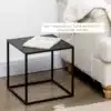 Diivanilaudade komplekt mustast terasest, minimalistlik | E-pood Tootemaailm Mustast terasest minimalistlik diivanilaudade komplekt, ruudukujuline laud valgusküllases elutoas, millel on avatud raamat ja lähedal valge diivan.