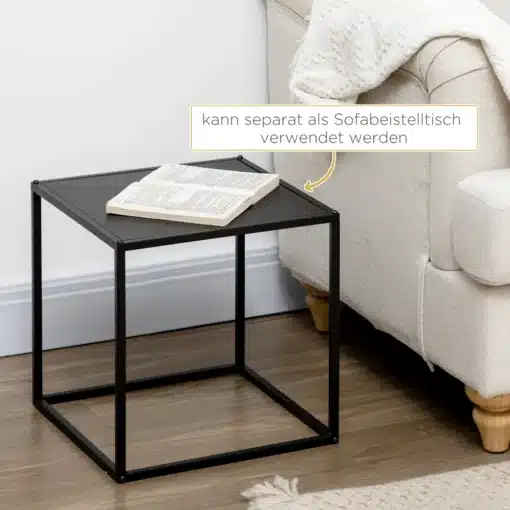 Diivanilaudade komplekt mustast terasest, minimalistlik | E-pood Tootemaailm Mustast terasest minimalistlik diivanilaudade komplekt, ruudukujuline laud valgusküllases elutoas, millel on avatud raamat ja lähedal valge diivan.
