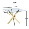 Ruutu kujuline söögilaud karastatud klaasist lauaplaadiga, mille all on kuldsed metalljalad ristatud kujul, asub neutraalsel taustal. Laua mõõtmed on märgitud: 80 cm lai, 80 cm pikk ja 75 cm kõrge.