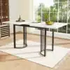 Laiendatav söögilaud metallraamiga, valge-must 140–180 cm | E-pood Tootemaailm Laiendatav söögilaud metallraamiga, valge-must, mõõtudes 140–180 cm, paistab avaras ja valgusküllases söögitoas. Laud on kaunistatud puuviljakausiga ja selle elegantne disain sobitub heleda puidust põrandaga.