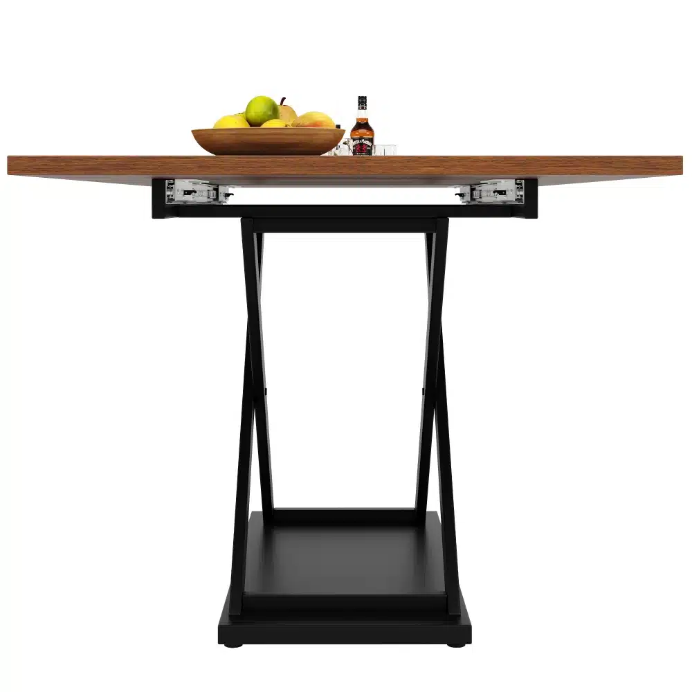 Laiendatav söögilaud metallraamiga, valge-must 140–180 cm. Pilt näitab lauda külgvaates, tume metallraam ja puidust pind, millele on asetatud kauss puuviljadega. Taust on minimalistlik ja neutraalne.