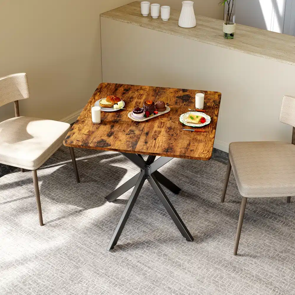 Ümmargune söögilaud 120 cm vintagepruun mustade metalljalgadega, köögis kaetud minimalistliku hommikusöögiga. Taustal hele sein ja moodne sisekujundus.
