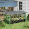 Tõstetud aiapeenar, mis on valmistatud tsingitud terasest võrguga, mõõtudega 230x110x110, paigaldatud aiaruumi rohelise muruga ja valgete lilledega.