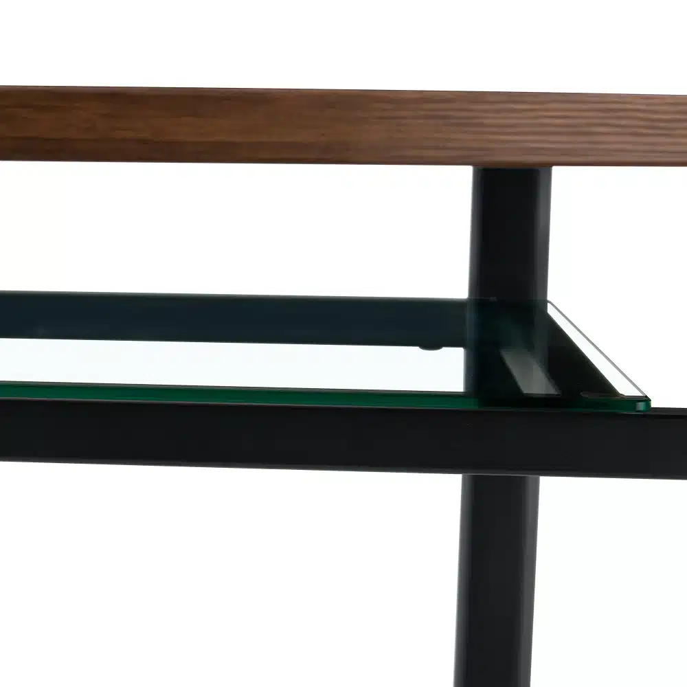 Ümmargune laud puiduspooni ja klaasdetailiga, musta värviga metallraamid ja selge klaaspind, minimalistlik disain.