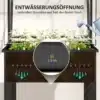 Kõrge aiapeenar kasvuhoone katte ja äravooluavadega | E-pood Tootemaailm Kõrge aiapeenar kasvuhoone katte ja äravooluavadega, täis valgeid õitsevaid lilli. Peenar on õigesti paigaldatud, äravool tagab vee korraliku juhtimise. Kastesüsteem toetab taimede tervislikku kasvu ka kitsastes ruumides.