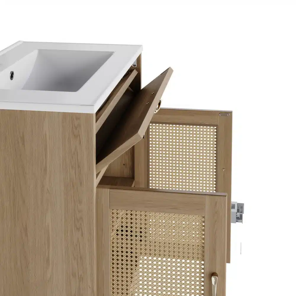 Hele vannitoakapp keraamilise valamuga, millel on puidust korpus ja avatud uks, revealingus vitspunutise detailidega uksepaneelid. Taust on neutraalne ja rõhutab kapi elegantset disaini.