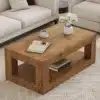 Diivanilaud kahe avatud riiuliga, vastupidav MDF, hele | E-pood Tootemaailm Hele MDF diivanilaud kahe avatud riiuliga, mille peal on raamat, kohvitass ja dekoratiivne vaas lilledega. Laua all asub mitu raamatut. Diivanilaud on hele ja sobib ideaalselt sooja tooniga toa interjööriga.