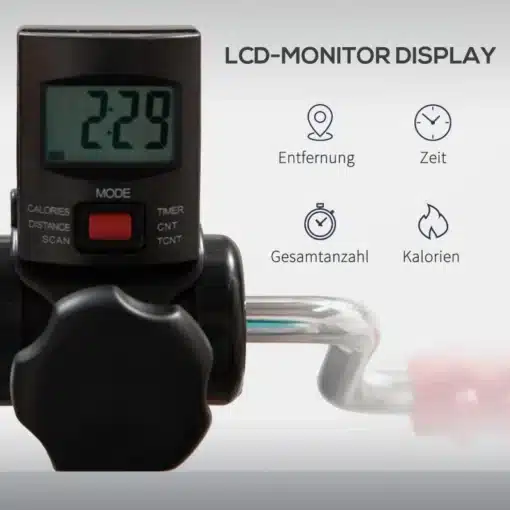 Mini pedaaltrenažöör eakatele LCD ekraani ja käepidemega | E-pood Tootemaailm Mini pedaaltrenažööri LCD ekraan, kus kuvatakse aeg, kalorid, distants ja muud treeningparameetrid. Ekraan on kompaktsel mustal paneelil koos punase nupuga, asetatud metalltorude peale.