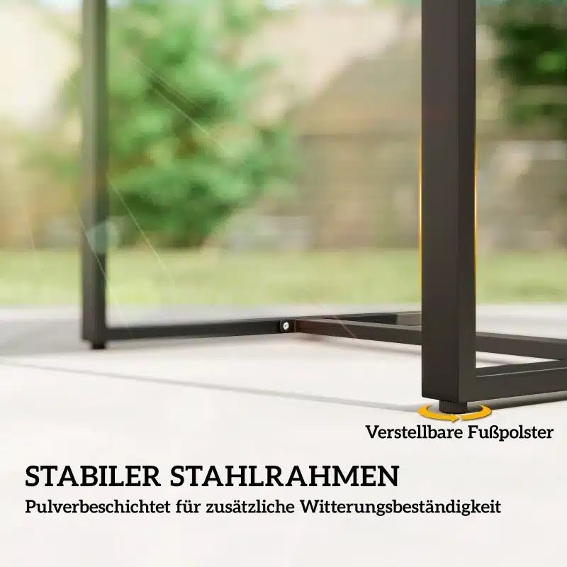 Stabiilne tumehall rotangist aiakomplekt, millel on terasraam ja reguleeritavad jalapadjad, rohelusega ümbritsetud taustal.
