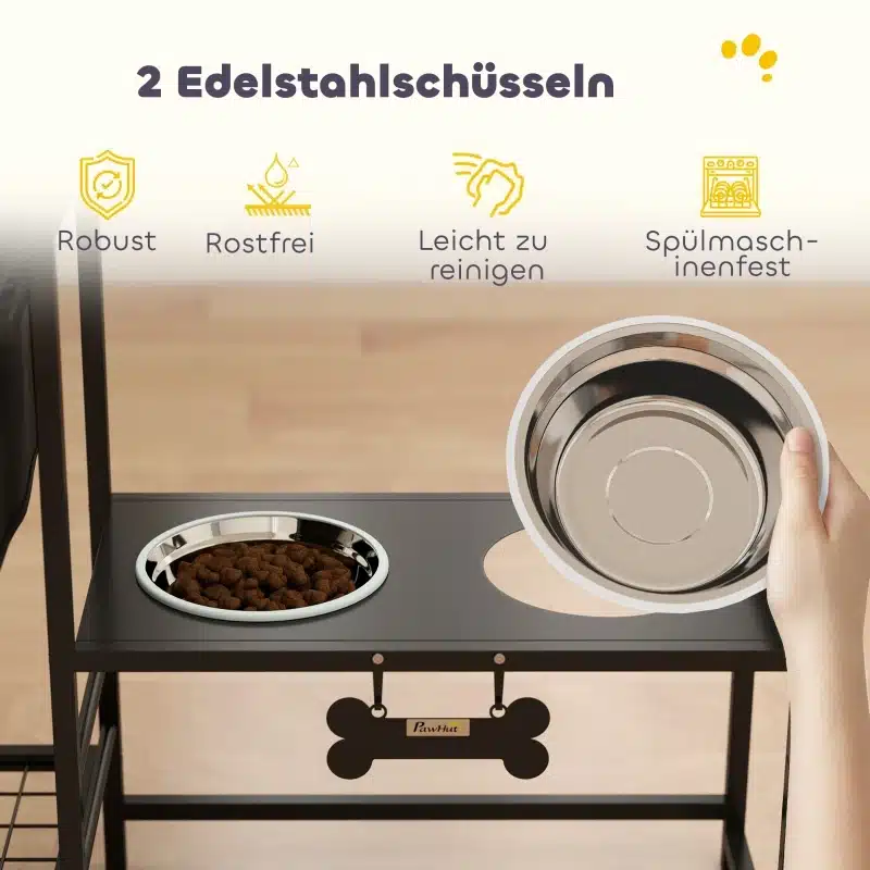 Metallist söötmisjaam koertele, musta raamiga, millel on kaks roostevabast terasest kaussi puidust põrandal. Üks kauss on kätte võetud, näidates selle lihtsat eemaldamise võimalust.