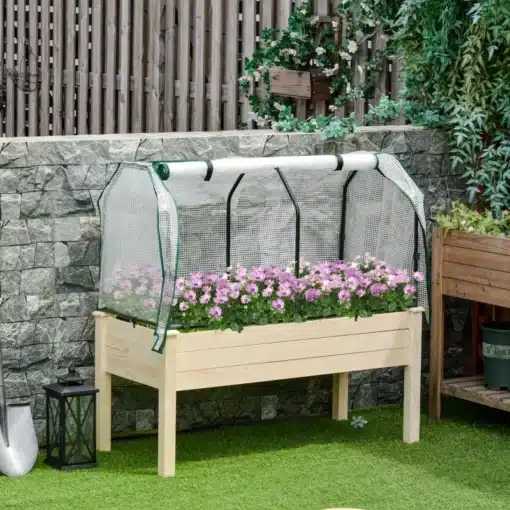 Kõrgendatud peenrakast rullkattega, puidust, 121x55x117 cm | E-pood Tootemaailm Pildil on puidust kõrgendatud peenrakast mõõtmetega 121x55x117 cm, kaetud rullkattega. Peenrakasti sees on roosade õitega lilled. Taustal on kivimüüritis ja rohelised taimed.