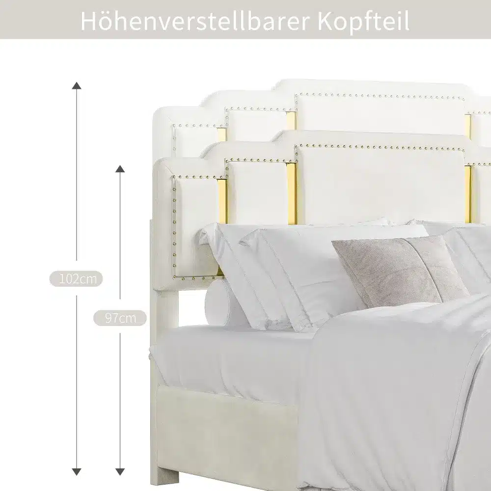 Beež velvetist kaheinimesevoodi mõõtmetega 160x200 cm, millel on kuldsed detailid ja reguleeritav peatsi osa. Voodi on kaunistatud elegantsete neetidega ja selle taustal on hele sein.