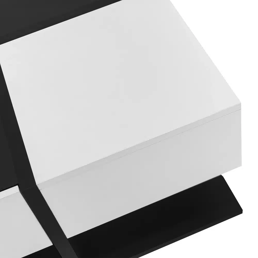 Diivanilaud kõrgläikega must-valge, kahe sahtliga, minimalistliku disainiga. Must ja valge pind moodustavad kontrastse ja elegantse välimuse.