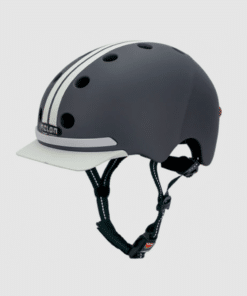 Hall linnakiiver M/L suuruses, millel on mugav kinnitusklamber, nähtud külgvaates heleroosal taustal. Kiivril on stiilsed ventilatsiooniavad ja minimalistlik disain, mis sobib ideaalselt linnaeluks.