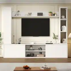Valge TV-seinariiul ja kapisüsteem musta televiisoriga, avatud riiulite ja kaunistustega