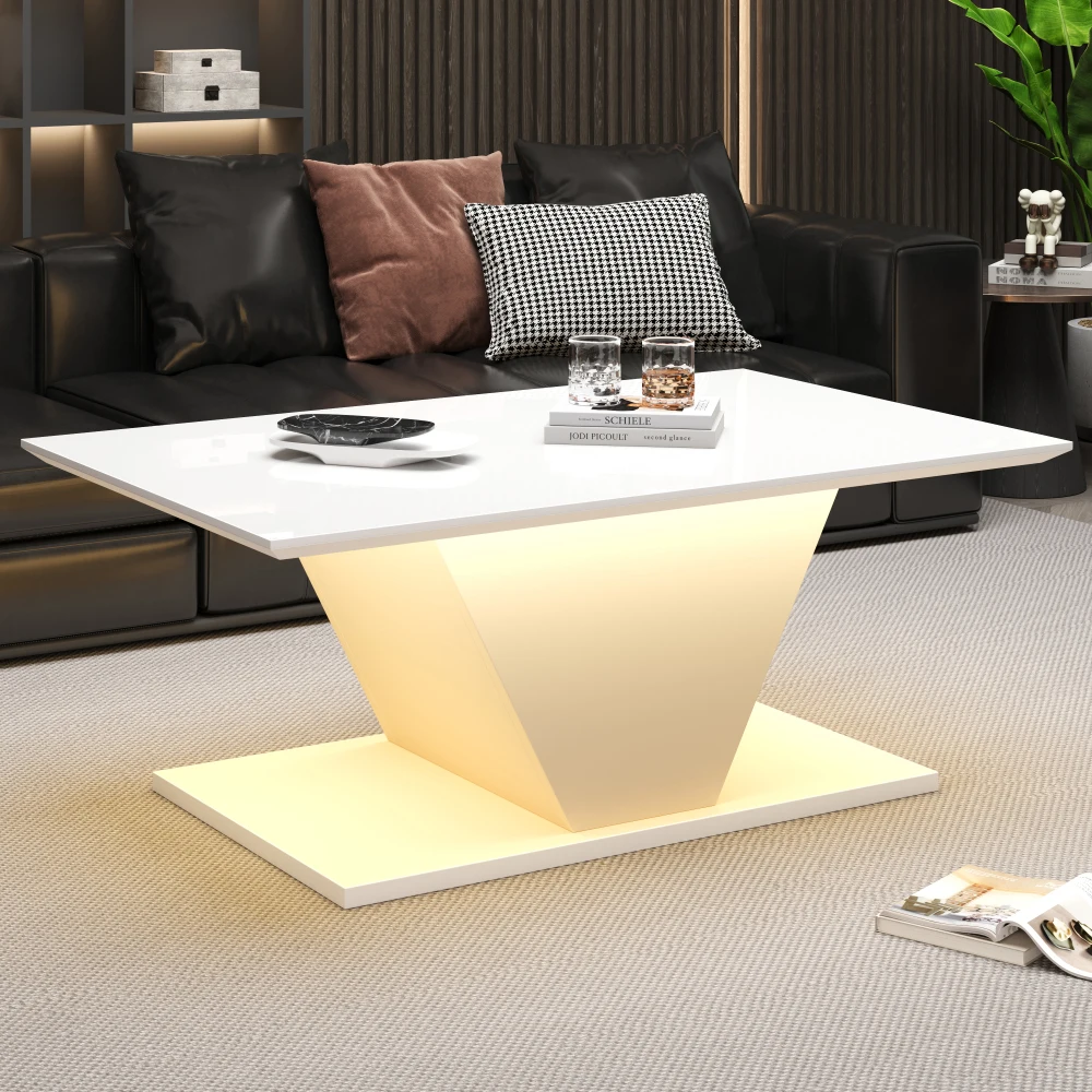 Valge LED-valgustusega kohvilaud modernses elutoas musta diivani ees