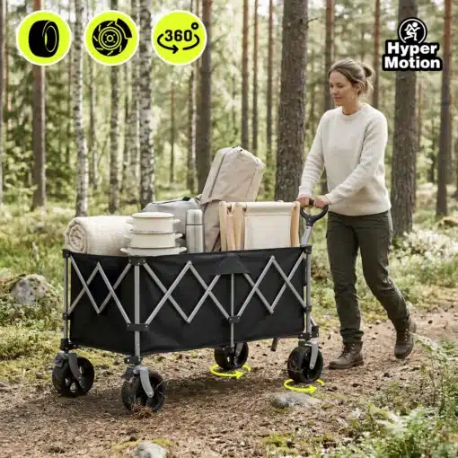 Kokkupandav transpordikäru 250 l ja kandevõimega 100 kg | E-pood Tootemaailm Must suurte ratastega veokäru metsarajal, mida lükkab naine; kärus on tekk, nõud ja termos