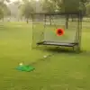 Golfi löögivõrk pallitagastussüsteemiga sise- ja välitreeninguks | E-pood Tootemaailm Golfiharjutusvõrk koos löögimati ja sihtmärgiga muruväljakul