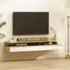 Seinale kinnitatavad öökapid sahtlite ja avatud riiulitega, 2 tk | E-pood Tootemaailm Seinale kinnitatud televiisor ja hele puidust TV-alus sahtlite ning avariiulitega elutoas